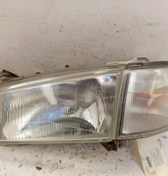 Optique avant principal gauche (feux)(phare) MAZDA DEMIO Photo n°1